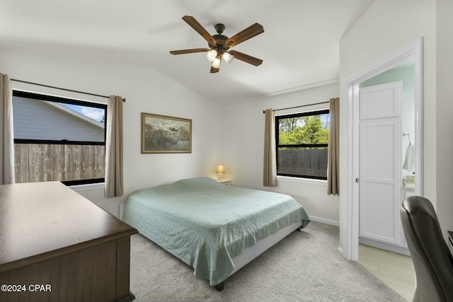 tiled bedroom with vaulted ceiling and ceiling fan