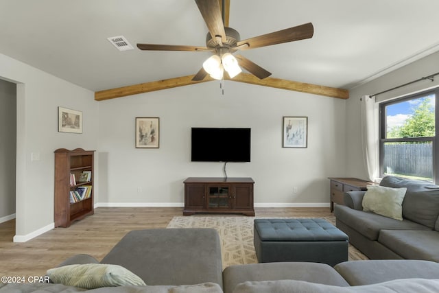 living room featuring vaulted ceiling with beams, light hardwood / wood-style flooring, and ceiling fan