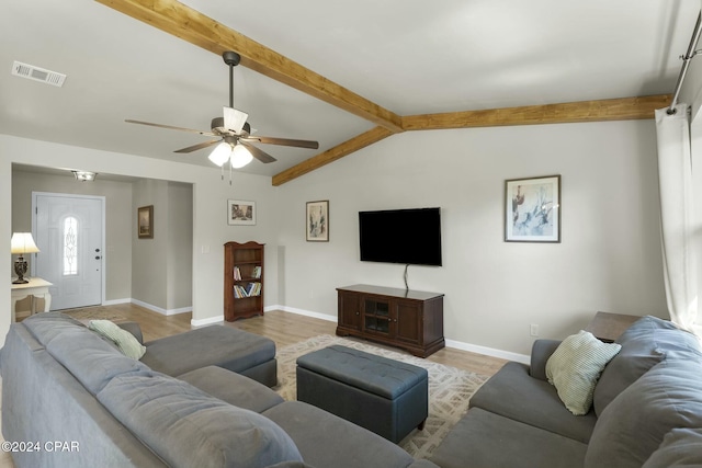 living room featuring vaulted ceiling with beams, ceiling fan, and light hardwood / wood-style floors