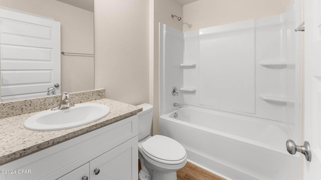 full bathroom featuring toilet, vanity, shower / bathtub combination, and hardwood / wood-style floors