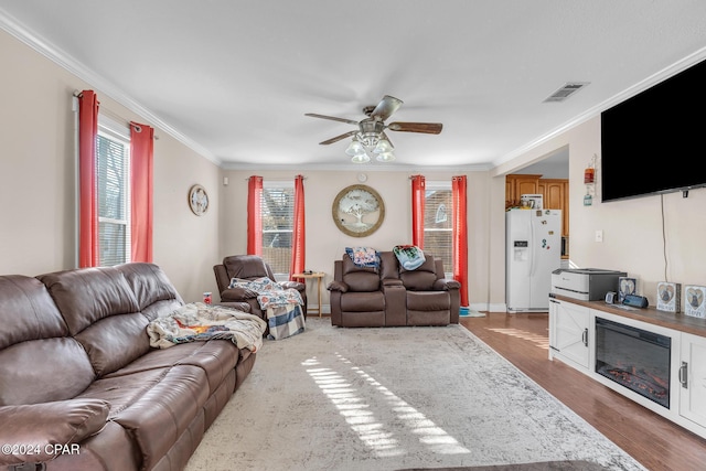 748 3rd St, Chipley, FL 32428 - living area featuring a ceiling fan, ornamental molding, and wood finished floors