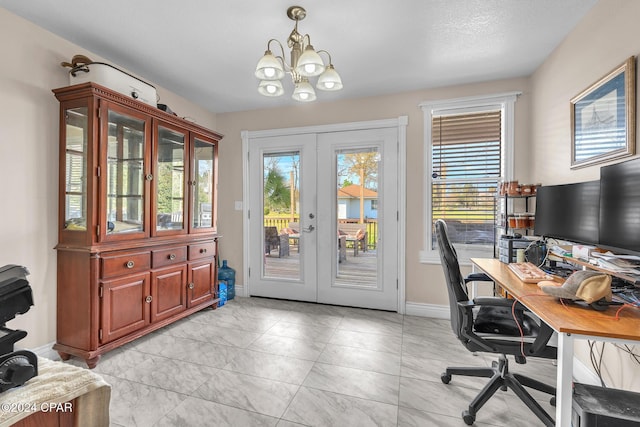 748 3rd St, Chipley, FL 32428 - home office with french doors, plenty of natural light, and a chandelier
