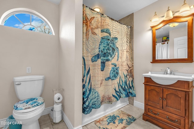 full bathroom with tile patterned floors, shower / bathtub combination with curtain, vanity, and toilet