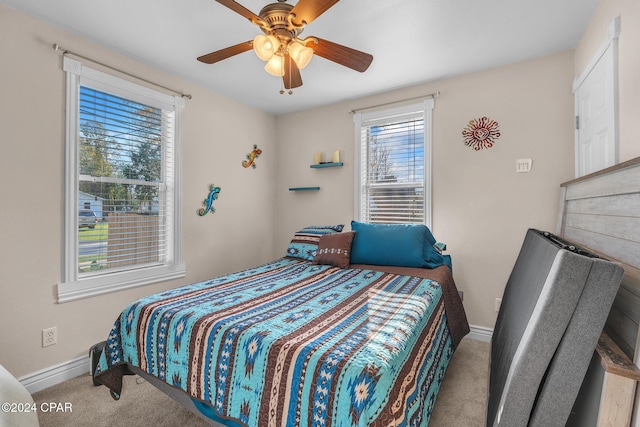 748 3rd St, Chipley, FL 32428 - bedroom with carpet flooring, baseboards, and ceiling fan