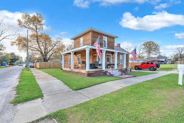 view of front of house featuring a front lawn and a porch