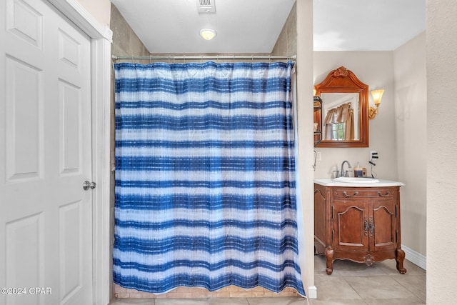 748 3rd St, Chipley, FL 32428 - full bathroom with tile patterned floors, vanity, and a shower with shower curtain