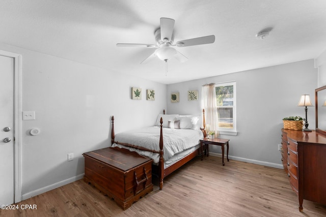 bedroom with ceiling fan and light hardwood / wood-style floors