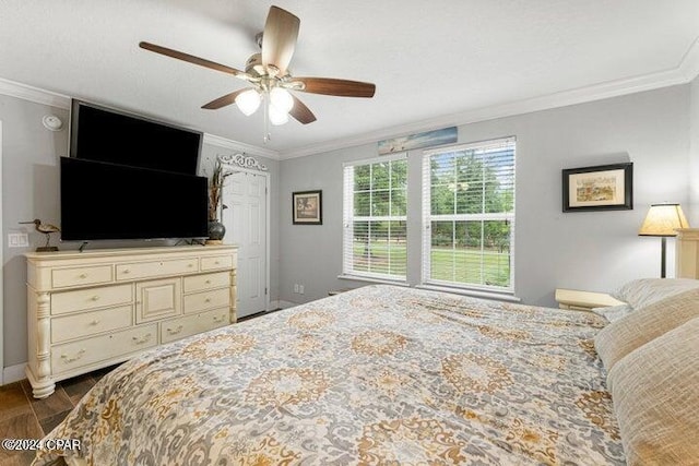 bedroom with ceiling fan and ornamental molding