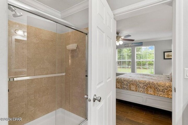 bathroom featuring walk in shower, ceiling fan, and ornamental molding