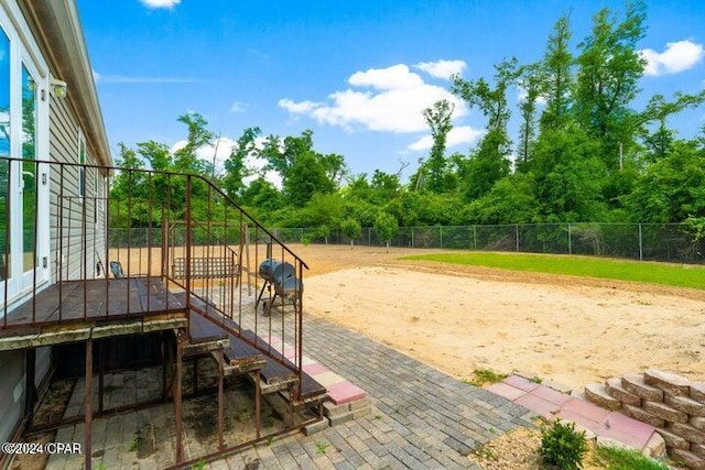 view of property's community with a patio area