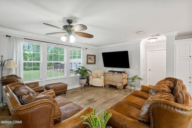 living room with crown molding, light wood-type flooring, and ceiling fan