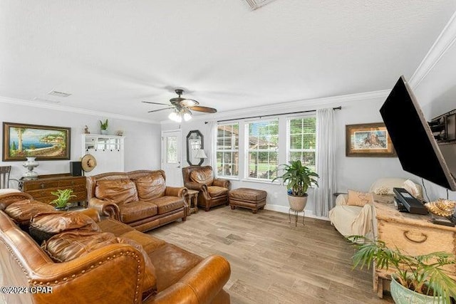 living room with crown molding, light wood-type flooring, and ceiling fan