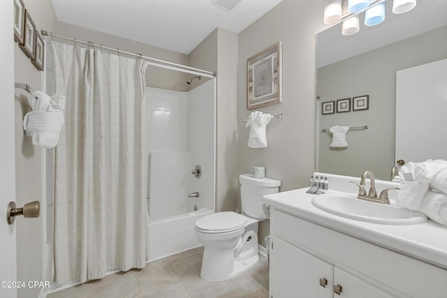 full bathroom featuring tile patterned flooring, vanity, toilet, and shower / bath combo with shower curtain