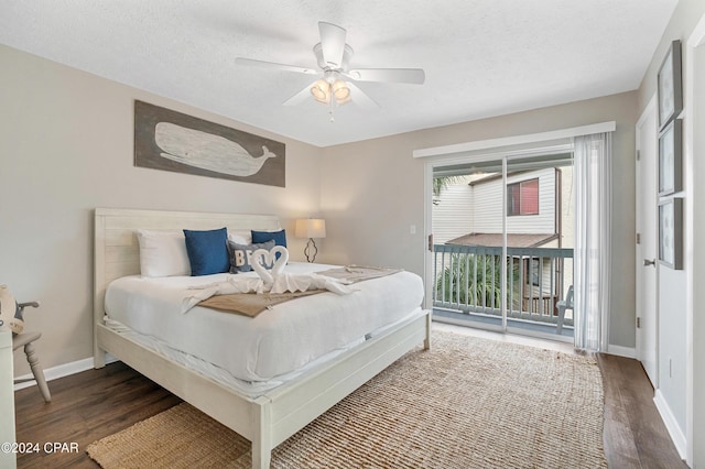 bedroom with a textured ceiling, access to exterior, ceiling fan, and dark hardwood / wood-style floors