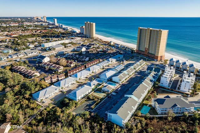 bird's eye view with a water view and a view of the beach