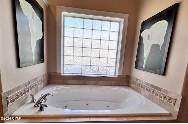 bathroom featuring tiled tub