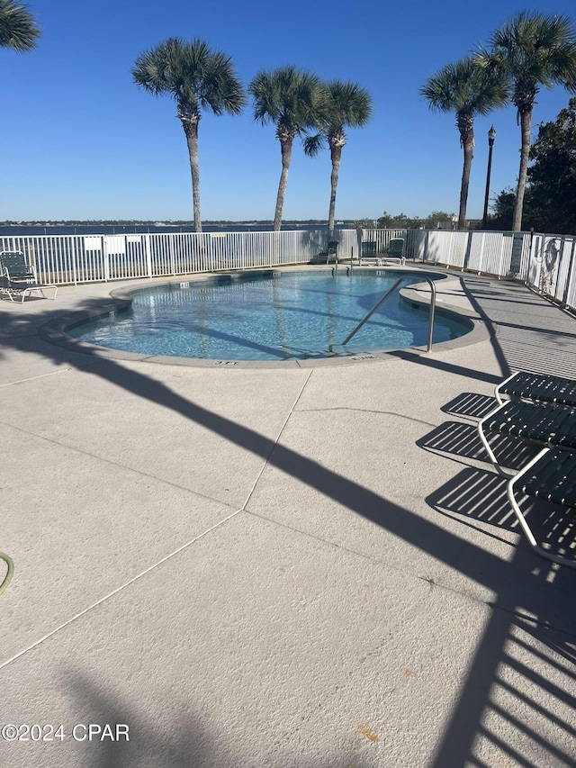 view of swimming pool with a patio