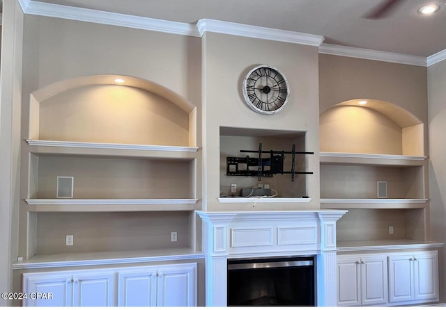 bar featuring white cabinets, built in features, and crown molding