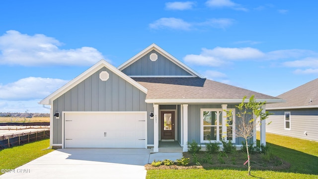 view of front facade with a front yard and a garage