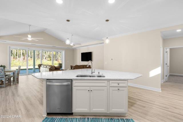 kitchen featuring stainless steel dishwasher, a ceiling fan, open floor plan, a sink, and light wood finished floors