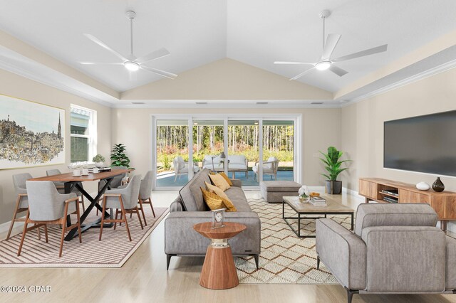 living area with vaulted ceiling, ceiling fan, and wood finished floors