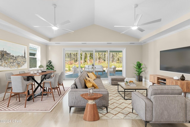 living area featuring vaulted ceiling, wood finished floors, and ceiling fan