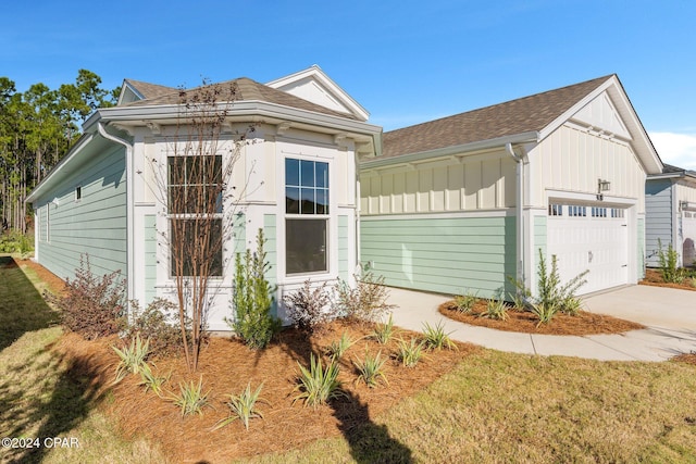 view of front of property featuring a garage, driveway, and board and batten siding