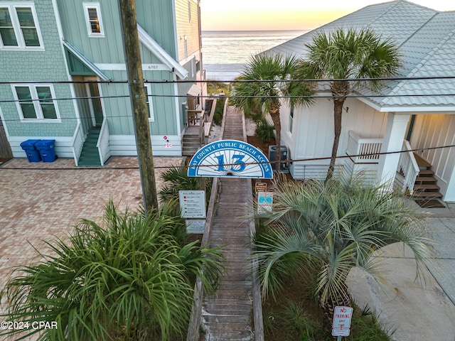 community sign featuring a water view