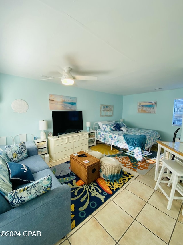 tiled bedroom with ceiling fan