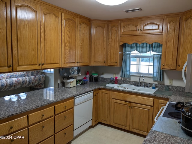 kitchen featuring dishwasher and sink