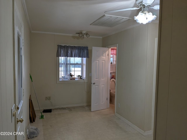 interior space with ceiling fan and ornamental molding