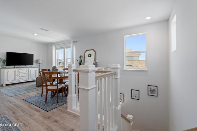 dining space featuring plenty of natural light and light wood-type flooring