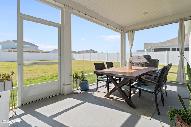 sunroom / solarium featuring wood ceiling