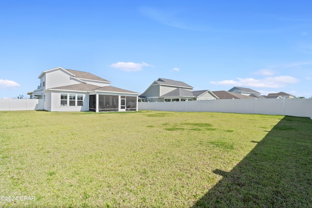 view of yard featuring a sunroom