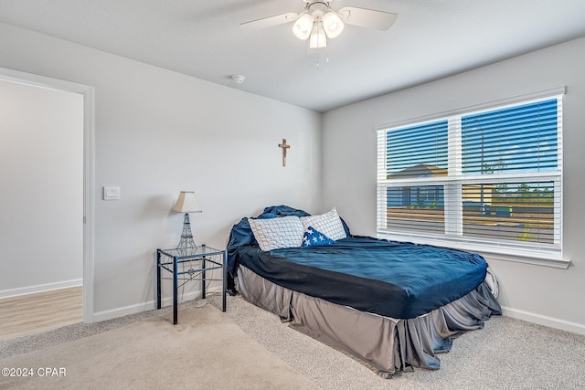 bedroom with ceiling fan and carpet floors