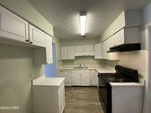 kitchen featuring white dishwasher, black electric range oven, white cabinetry, and sink