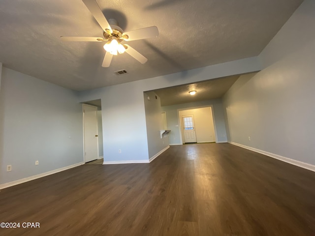 unfurnished room with ceiling fan and dark hardwood / wood-style floors