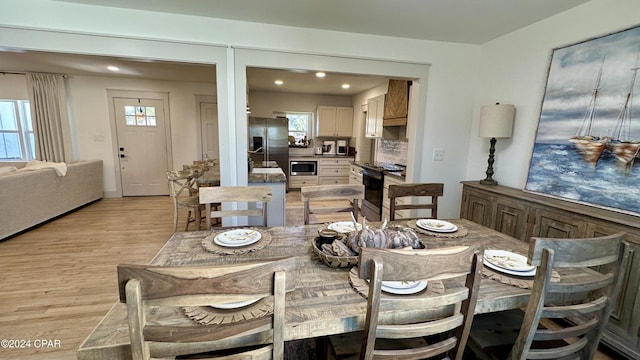 dining area with light wood-type flooring