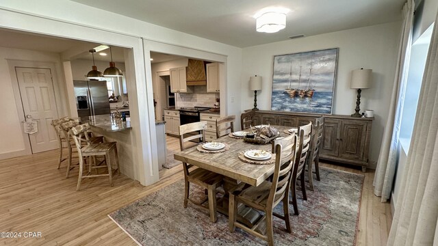 dining room featuring light hardwood / wood-style flooring