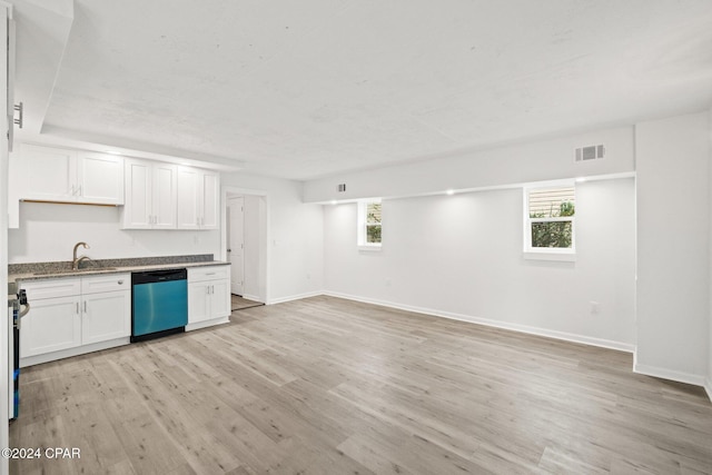 kitchen featuring white cabinets, dishwasher, a healthy amount of sunlight, and light hardwood / wood-style flooring