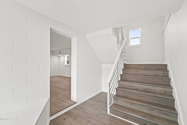 stairway featuring hardwood / wood-style floors