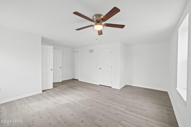 interior space featuring light wood-type flooring and ceiling fan