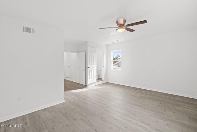 unfurnished room with ceiling fan and hardwood / wood-style floors