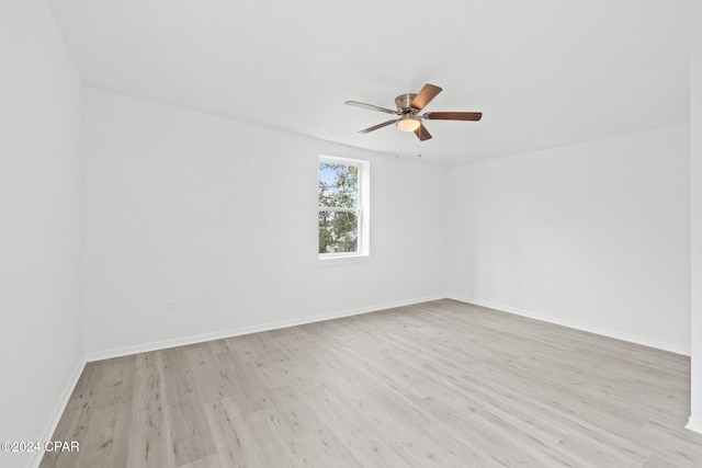 empty room with light wood-type flooring and ceiling fan