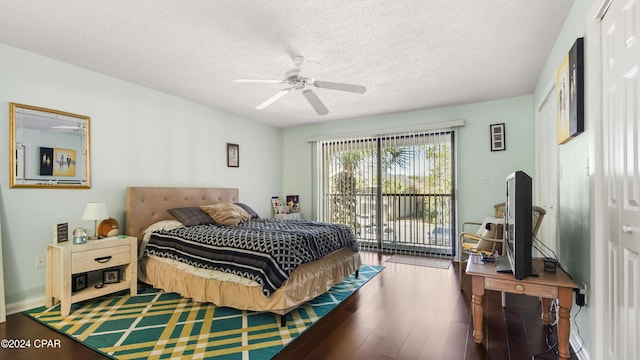 bedroom with ceiling fan, wood-type flooring, access to exterior, and a textured ceiling