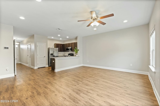 unfurnished living room featuring light hardwood / wood-style floors and ceiling fan