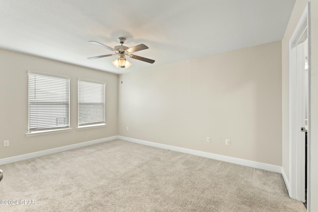 carpeted empty room with ceiling fan