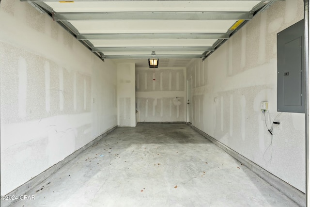 garage with electric panel and a garage door opener