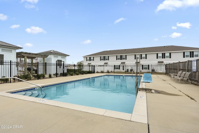 view of swimming pool with a patio