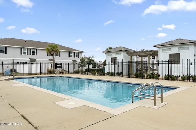 view of swimming pool with a patio